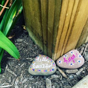 Inspirational rocks at the base of the Little Red Mailbox